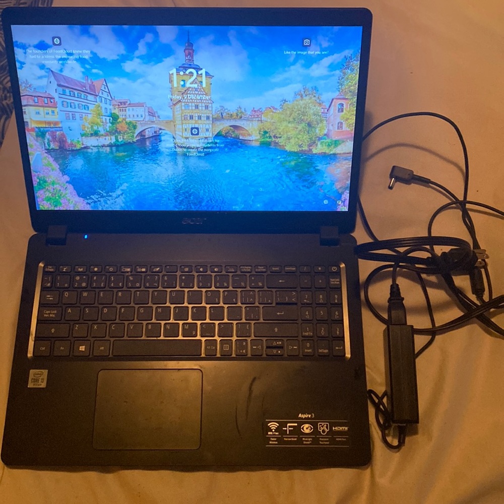 An acer laptop with charger